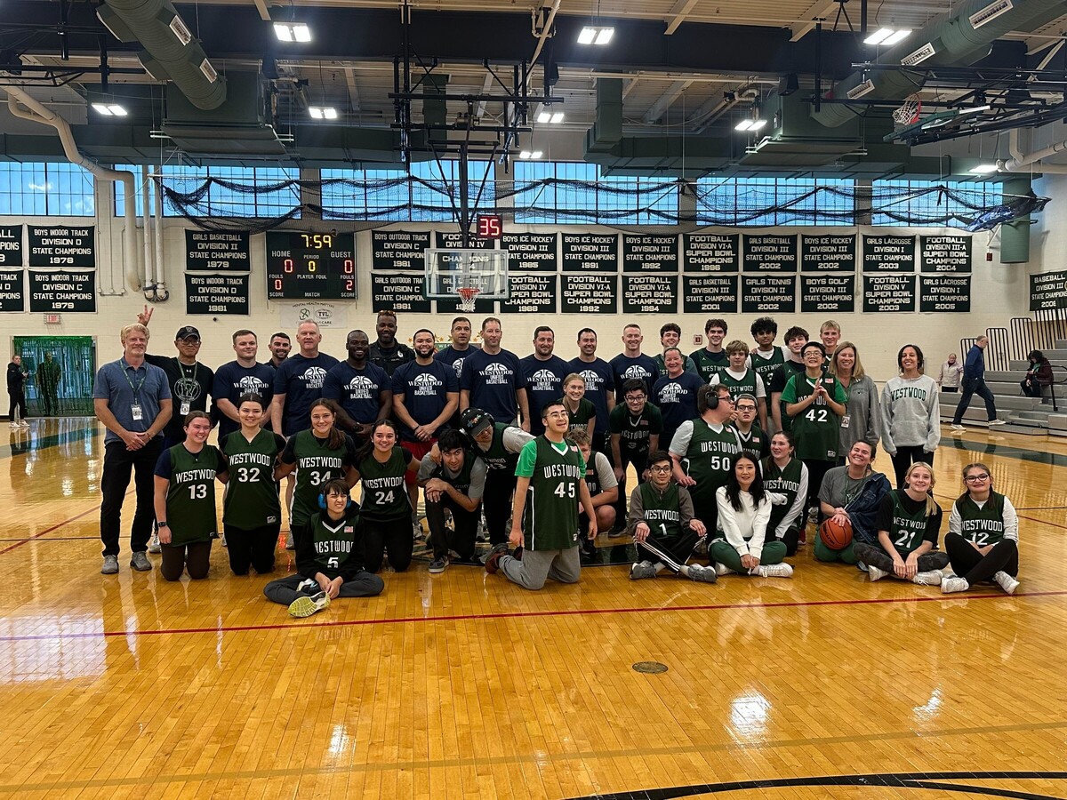 Westwood Police Officers Tip Off Against the WHS Unified Basketball Team